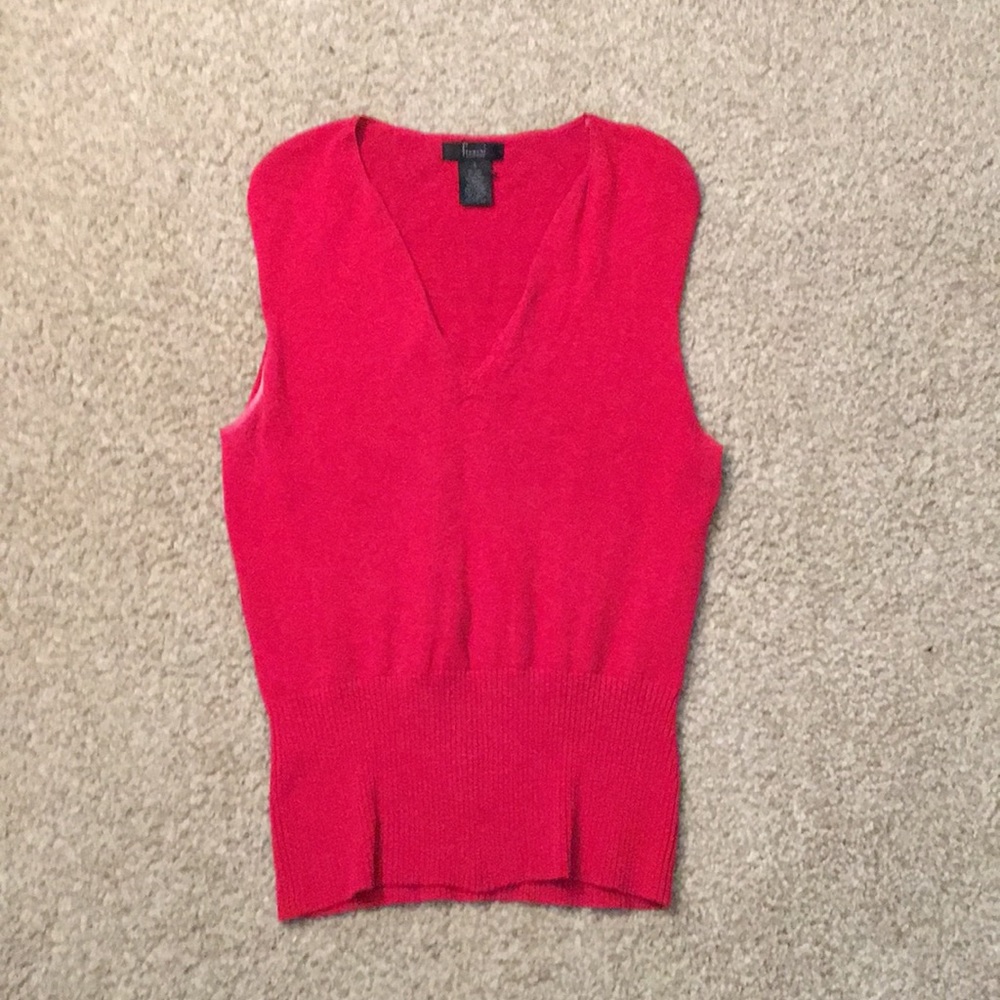 A red sweater vest.
